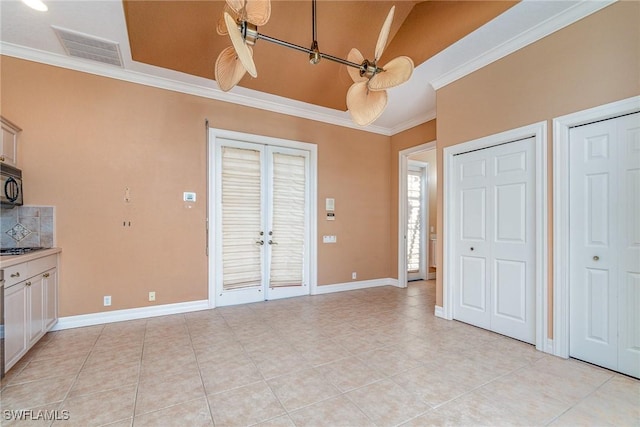 interior space featuring french doors, ceiling fan, and crown molding