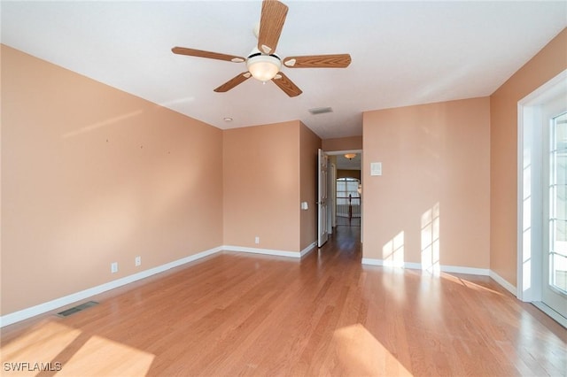 empty room featuring light wood-type flooring and ceiling fan