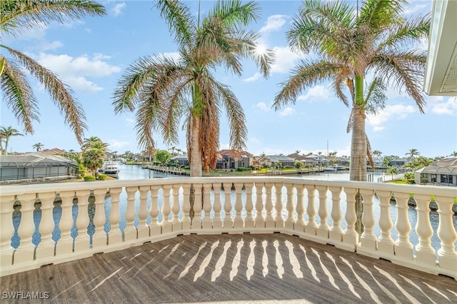 wooden terrace featuring a water view