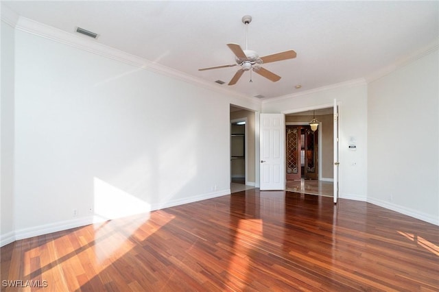 unfurnished room with ceiling fan, dark hardwood / wood-style flooring, and crown molding