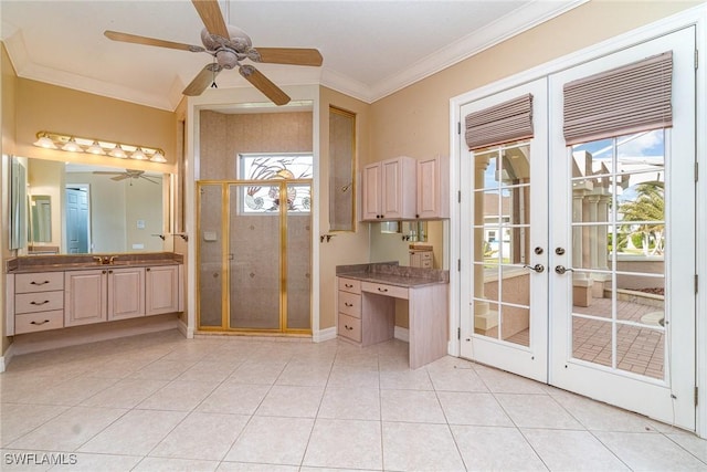 entryway featuring sink, french doors, light tile patterned floors, and ornamental molding