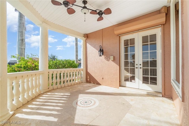 view of patio with ceiling fan, covered porch, and french doors