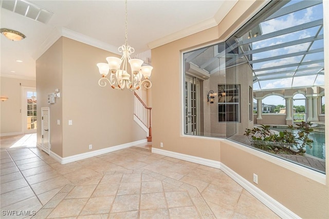 interior space featuring a chandelier, tile patterned flooring, plenty of natural light, and ornamental molding