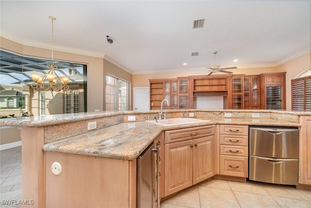 kitchen featuring light stone countertops, stainless steel dishwasher, ornamental molding, ceiling fan with notable chandelier, and sink