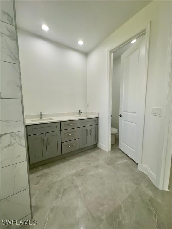 bathroom with vanity and toilet