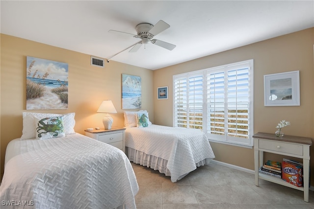 tiled bedroom with ceiling fan