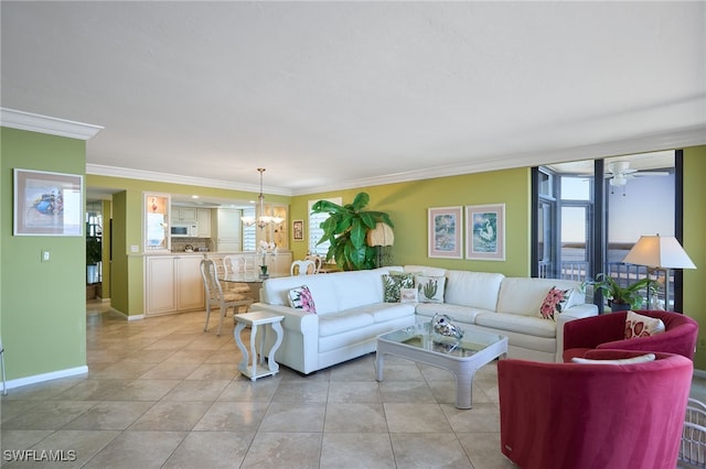 tiled living room featuring ceiling fan with notable chandelier and ornamental molding