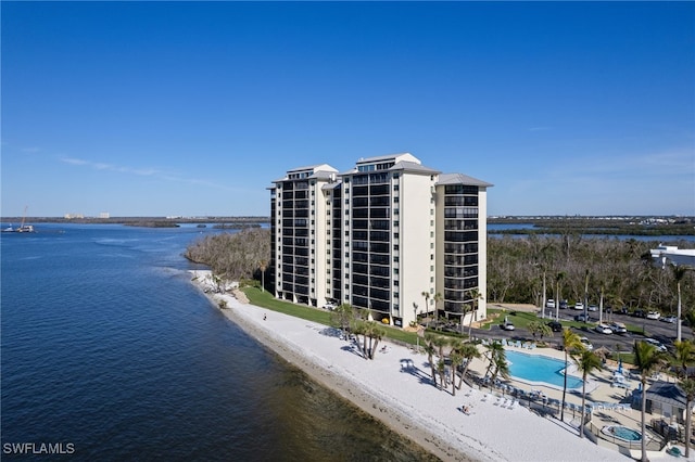 bird's eye view with a water view and a beach view