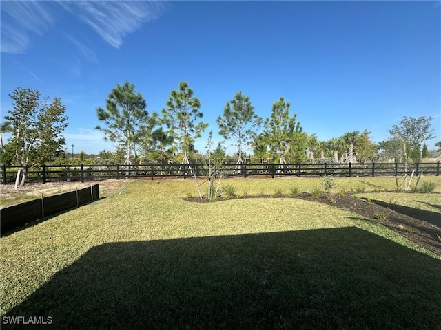 view of yard featuring fence