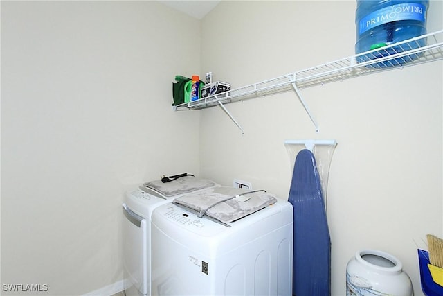 laundry room featuring washer and clothes dryer