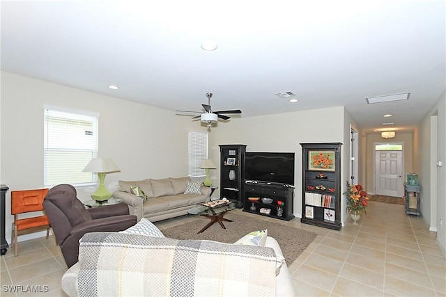 tiled living room featuring ceiling fan