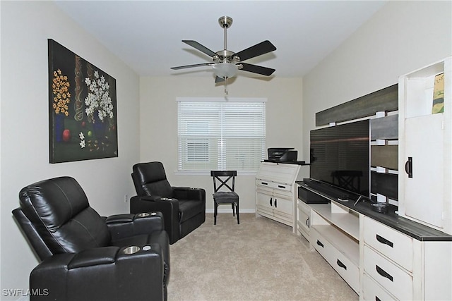 carpeted living room with ceiling fan