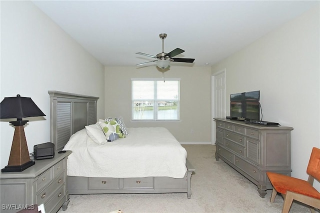 bedroom with light carpet and ceiling fan