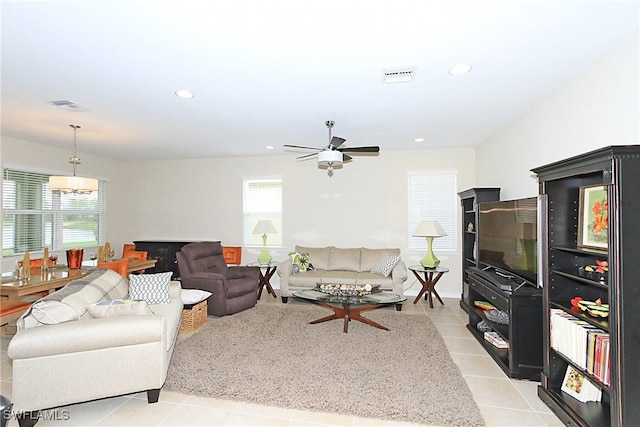 living room with ceiling fan and light tile patterned flooring