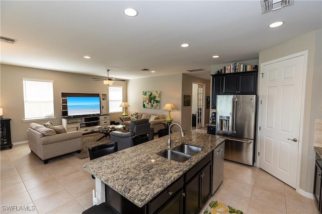 4147 Dutchess Park Rd, Fort Myers, FL 33916 - kitchen with appliances with stainless steel finishes, light tile patterned flooring, recessed lighting, light stone counters, and open floor plan