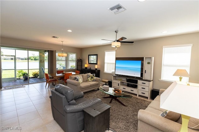 4147 Dutchess Park Rd, Fort Myers, FL 33916 - living area with ceiling fan, recessed lighting, light tile patterned floors, and a water view