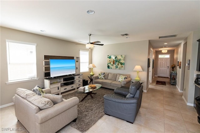 4147 Dutchess Park Rd, Fort Myers, FL 33916 - living area with healthy amount of natural light, light tile patterned floors, and ceiling fan