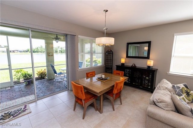 4147 Dutchess Park Rd, Fort Myers, FL 33916 - dining room featuring a water view and light tile patterned floors