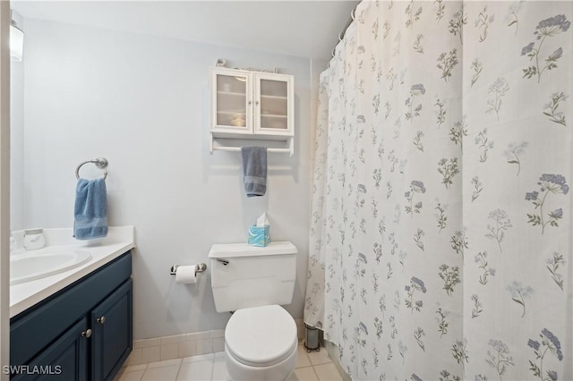 bathroom featuring tile patterned floors, vanity, toilet, and a shower with shower curtain