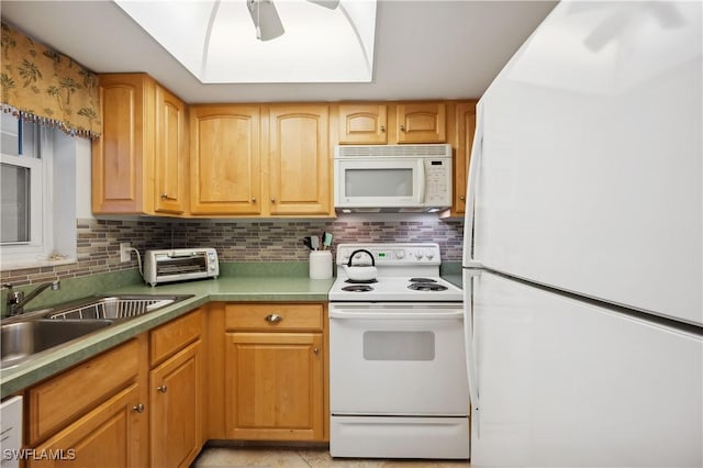 kitchen with ceiling fan, sink, tasteful backsplash, white appliances, and light tile patterned floors