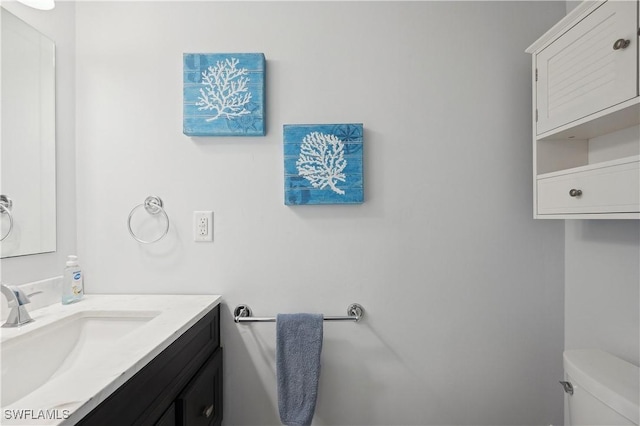 bathroom with vanity and toilet