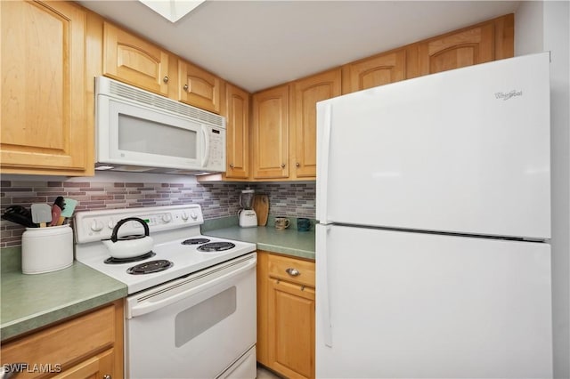 kitchen featuring light brown cabinets, white appliances, and tasteful backsplash