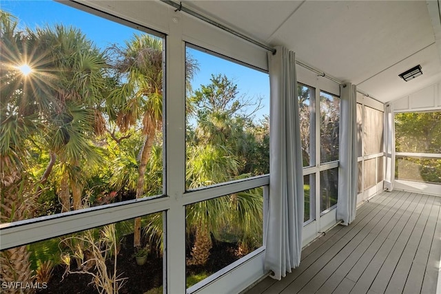 unfurnished sunroom with vaulted ceiling