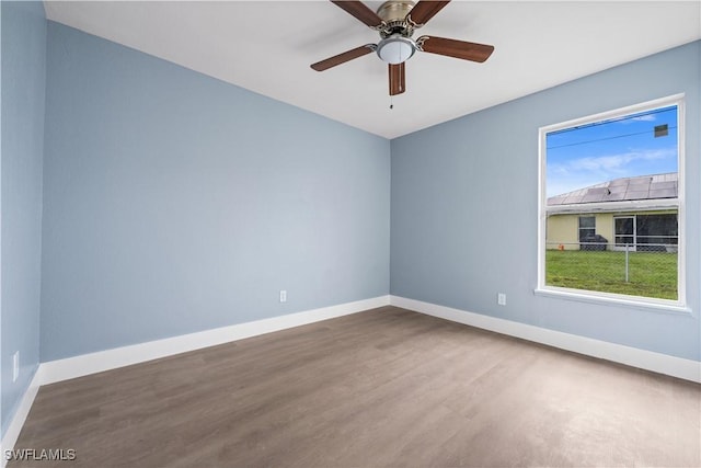 empty room featuring hardwood / wood-style floors and ceiling fan