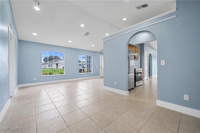 unfurnished living room featuring light tile patterned floors