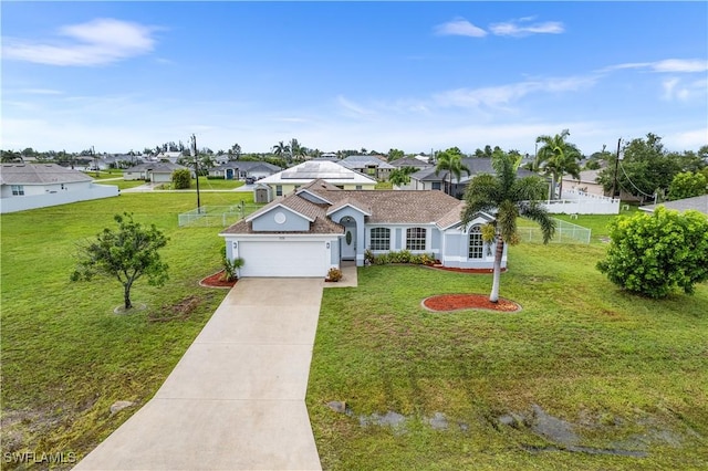 view of front of property featuring a garage and a front lawn