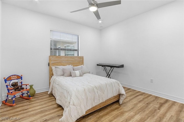 bedroom featuring wood-type flooring and ceiling fan