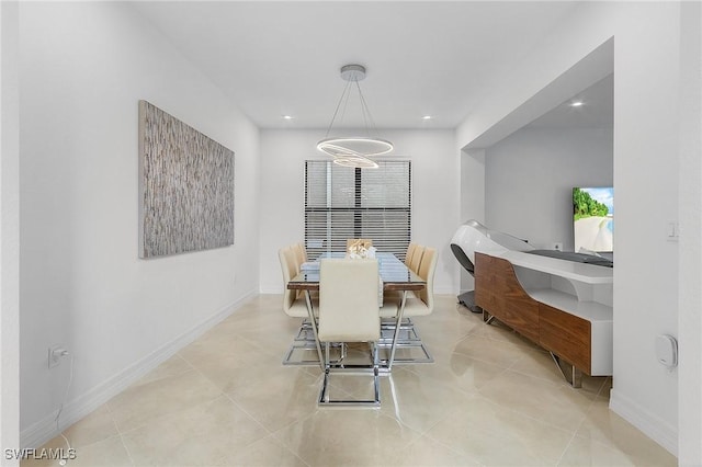 dining area featuring light tile patterned floors