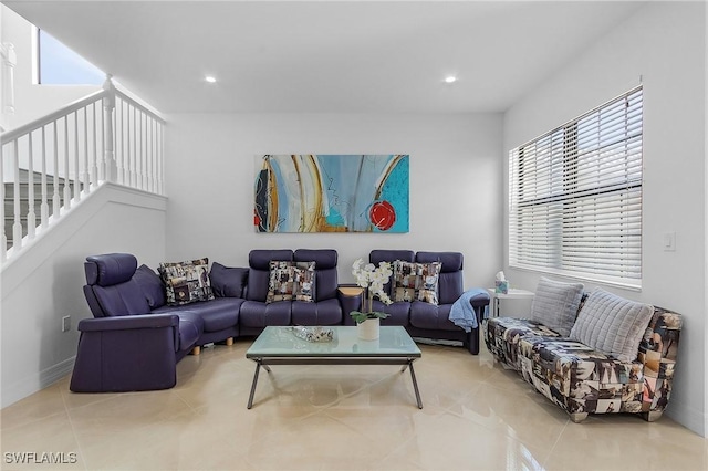 tiled living room featuring a healthy amount of sunlight