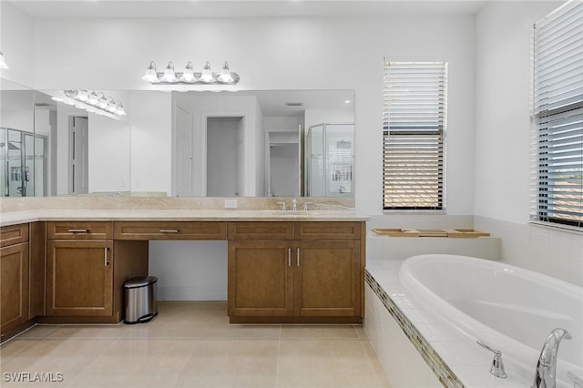 bathroom with independent shower and bath, vanity, and tile patterned floors