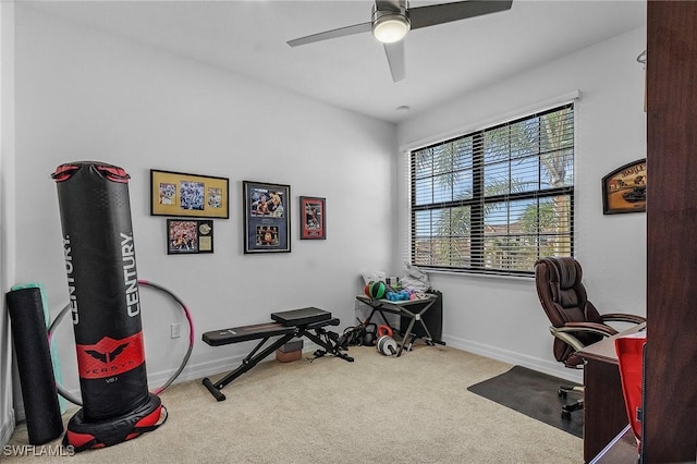 carpeted office featuring plenty of natural light and ceiling fan