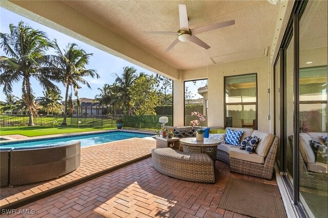 exterior space featuring ceiling fan, outdoor lounge area, and a patio