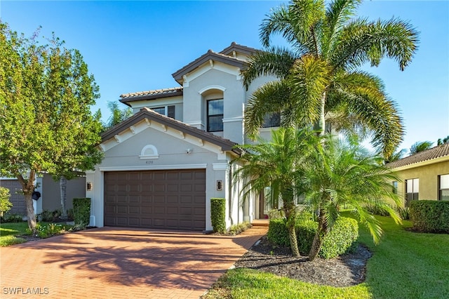 mediterranean / spanish-style house featuring a garage