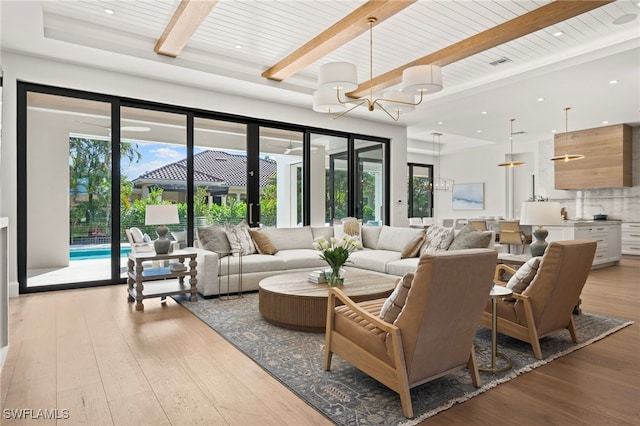 living room with beamed ceiling, wooden ceiling, an inviting chandelier, and light hardwood / wood-style flooring