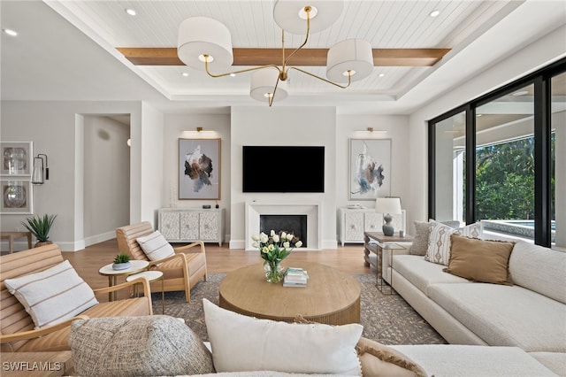 living room with beam ceiling, wood-type flooring, and wooden ceiling