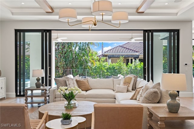 living room featuring beam ceiling and hardwood / wood-style floors