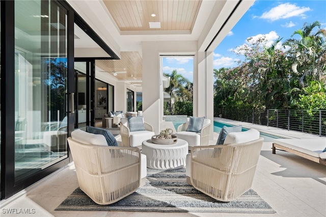 view of patio / terrace featuring a fenced in pool