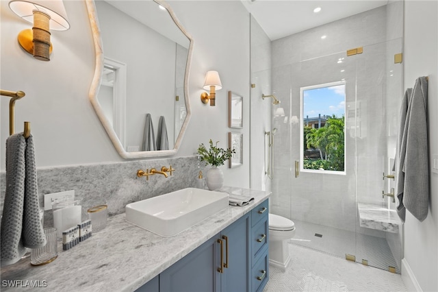 bathroom with vanity, tile patterned flooring, a shower with shower door, and toilet