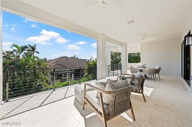 view of patio / terrace with a balcony