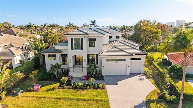 view of front property with a garage and a front lawn