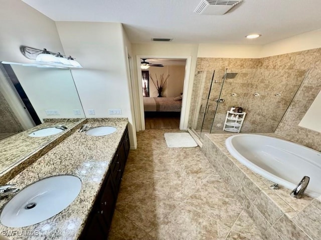 bathroom featuring ceiling fan, vanity, and separate shower and tub