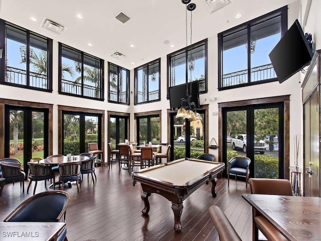 rec room with billiards, dark hardwood / wood-style flooring, and french doors