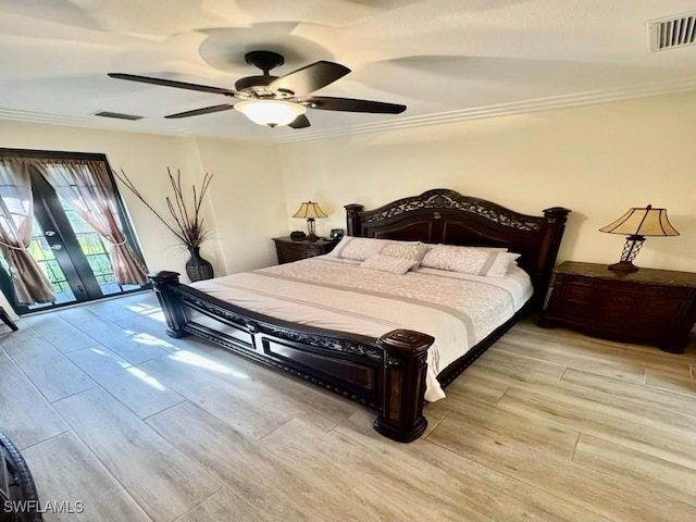 bedroom featuring ceiling fan, ornamental molding, and french doors