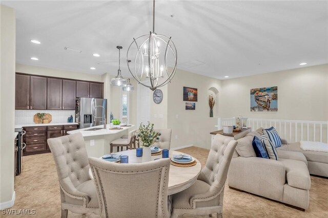 dining space with a chandelier