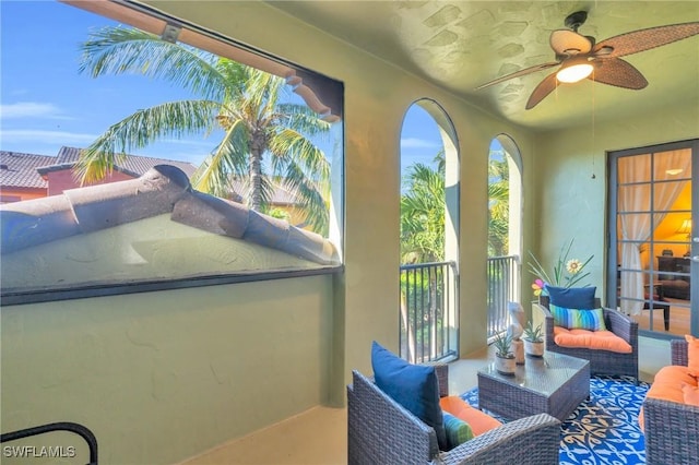 sunroom / solarium with ceiling fan