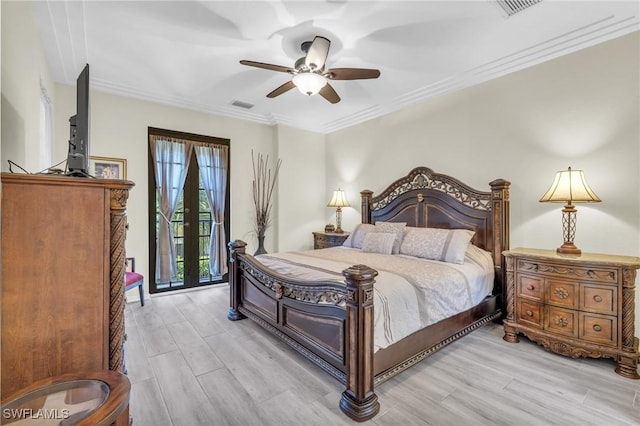 bedroom with crown molding, ceiling fan, and light hardwood / wood-style flooring